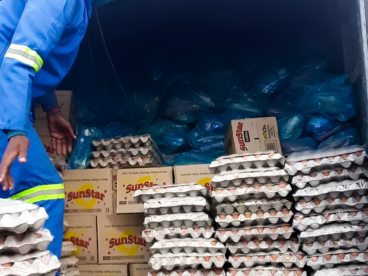 Volunteers handing out food parcels